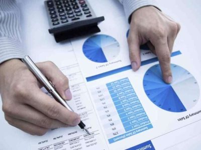 man hand with pen and business report man hand with pen and business report. Accounting